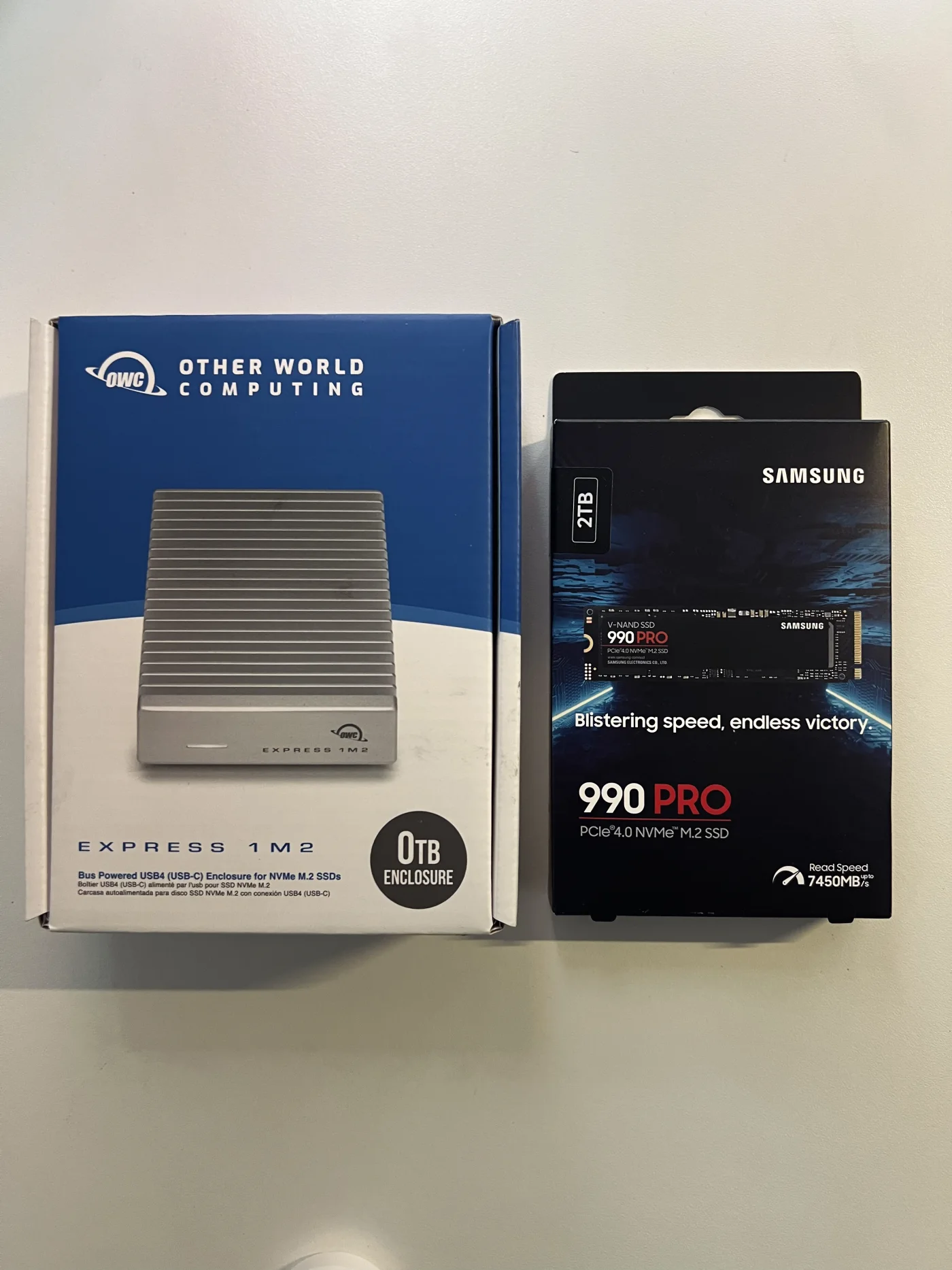 OWC Express 1M2 box beside the Samsung 990 PRO 2TB SSD box.